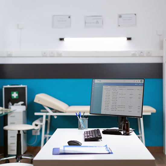 Empty healthcare medical office, no people in modern hospital interior. Computer on desk with examining diagnostic data, checking for disease in doctor medical space